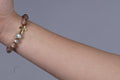 Multicolor bracelet with a cross charm